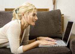 Woman on couch with laptop