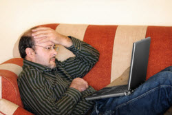 Worried man at laptop