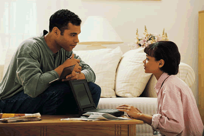 man and woman talking at home