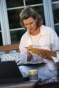 woman looking at her bank statement