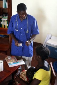 health worker with woman and baby in Mozambique