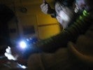 Photo of students experimenting with a flashlight.