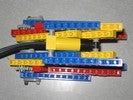 A standard Lego claw run by a pneumatic pump sensor.