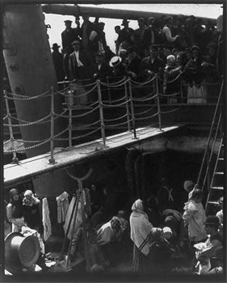 Black/white photo of immigrants on steerage deck of ship.