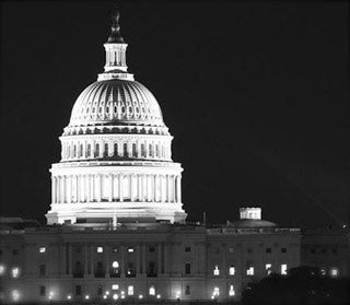 Black and white photo of U.S. Capitol at night.