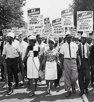 A group of picketers carrying protest signs.