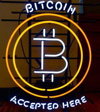 Bitcoin accepted here neon sign.