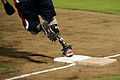 A member of the Wounded Warrior Amputee Softball Team (WWAST) rounds first base during a double header softball game against the Hickam Force and Hickam Chiefs teams 130108-F-ZB240-696.jpg