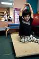 US Navy 100306-N-5319A-035 Ten-year-old Joseph Camano performs stretching exercises before a routine physical therapy session with Occupational Therapist Judy Anderson at the Diane Epplein ^ Assoc. Pediatric Therapy facility.jpg